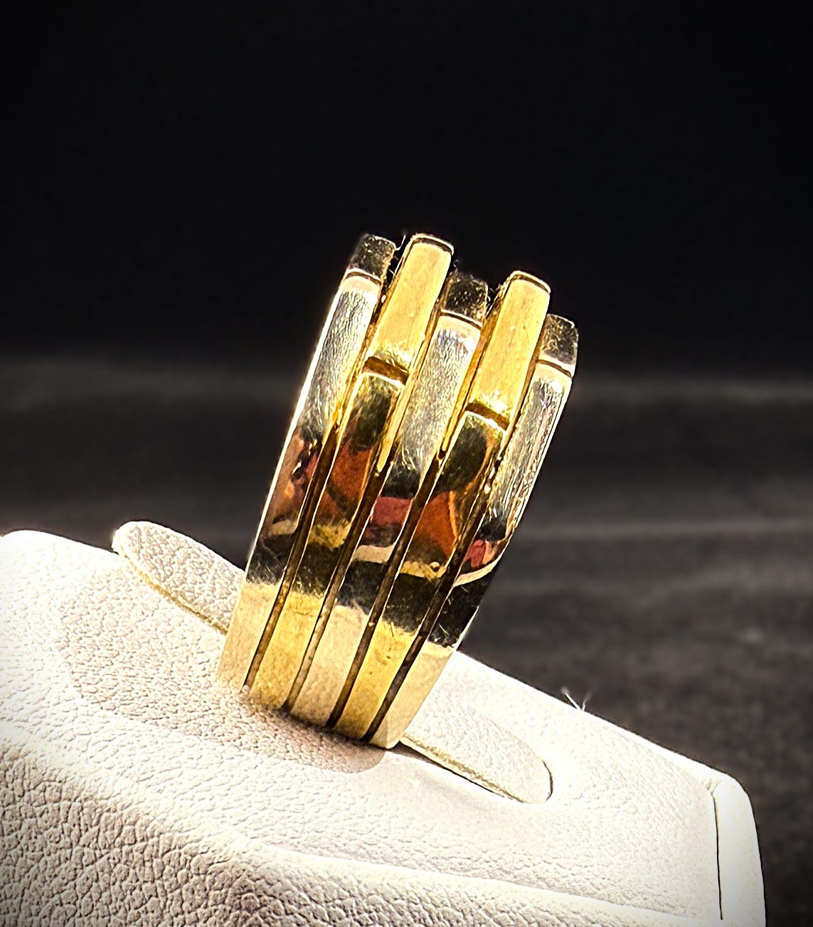 Side view of chunky 18k yellow and white gold ring showing the elevated geometric profile and smooth polished shank